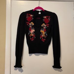 Black sweater with embroidered flowers